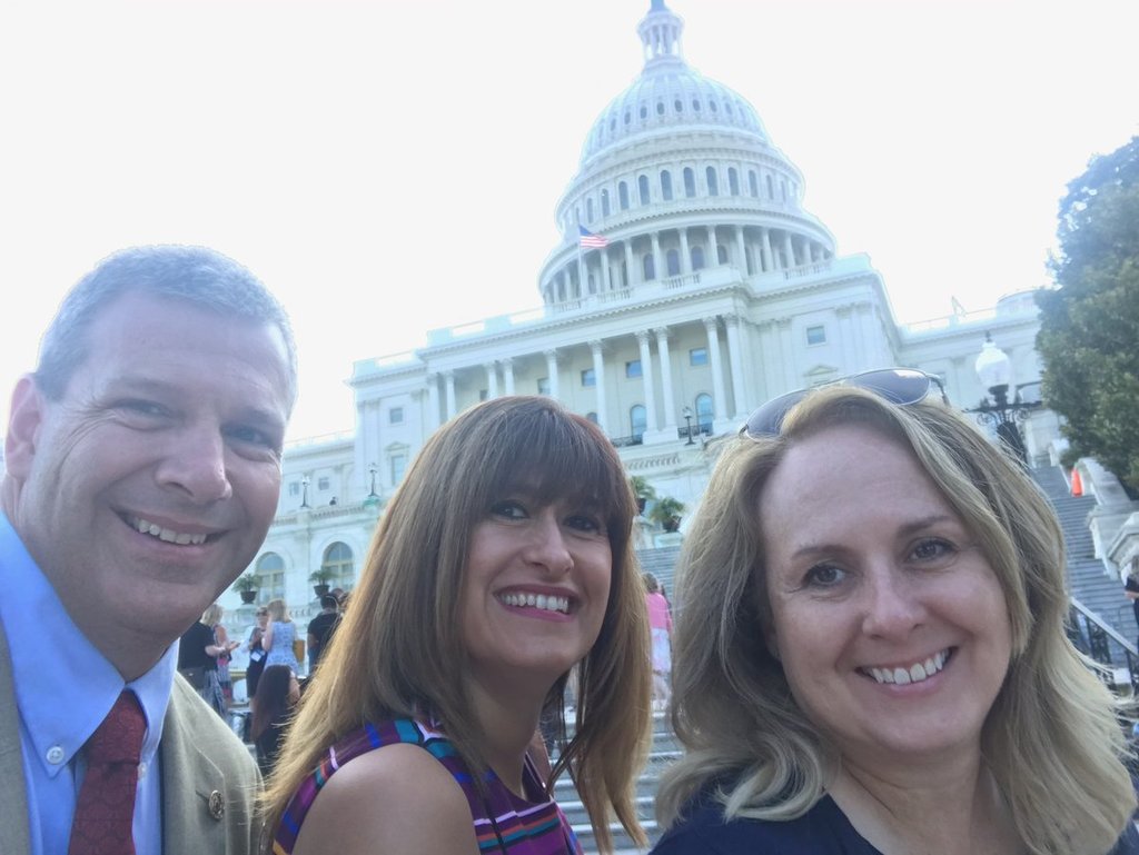 Colleagues posing in front of United States Capitol